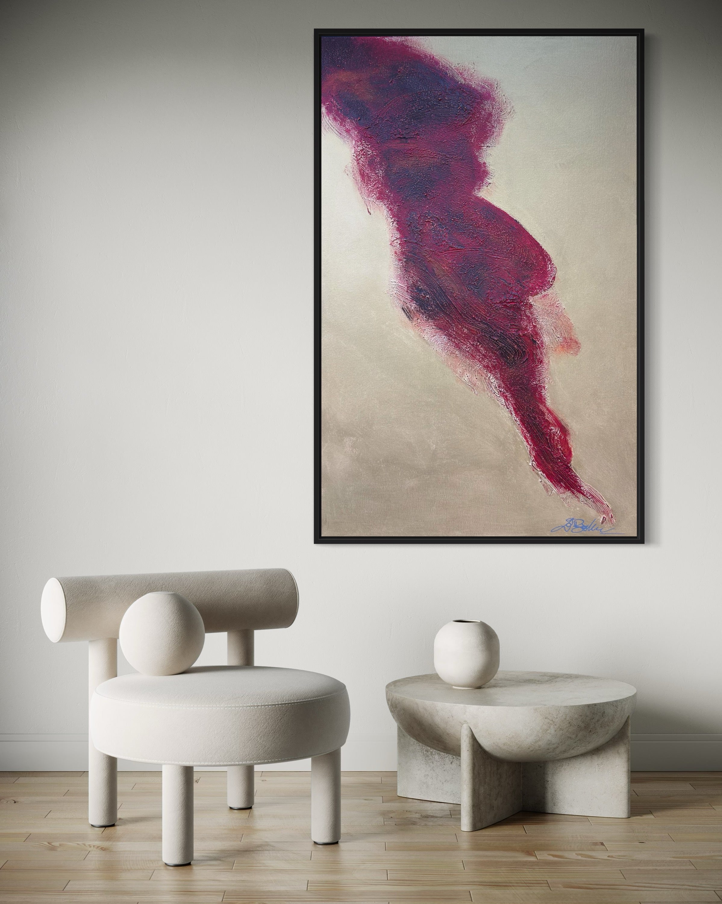 Abstract art piece in a modern interior setting with a chair and table.