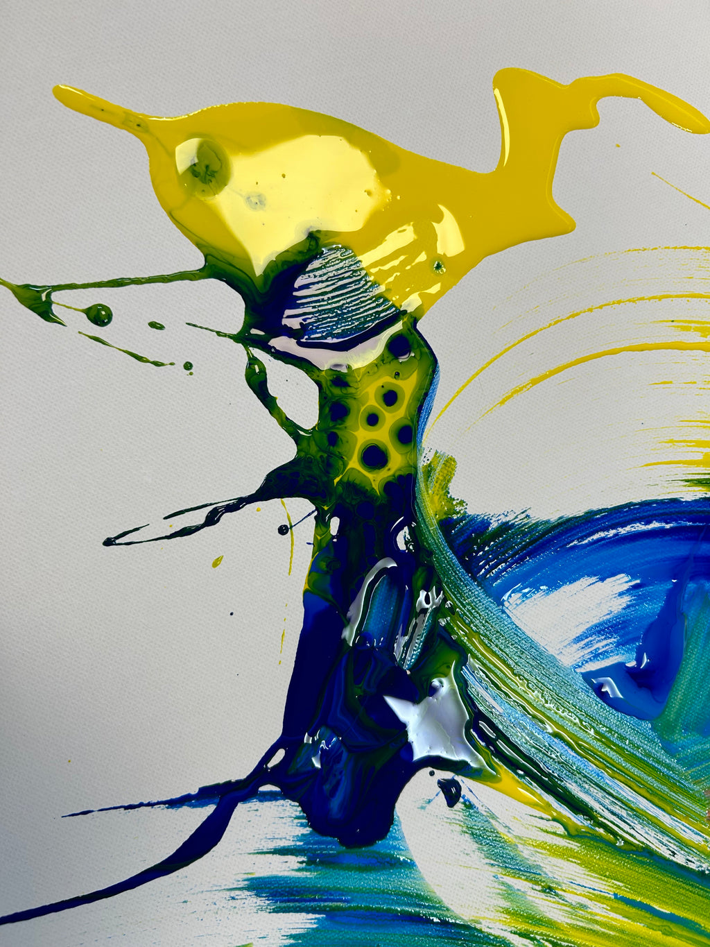 Abstract art with yellow, blue, and green colors on a white background