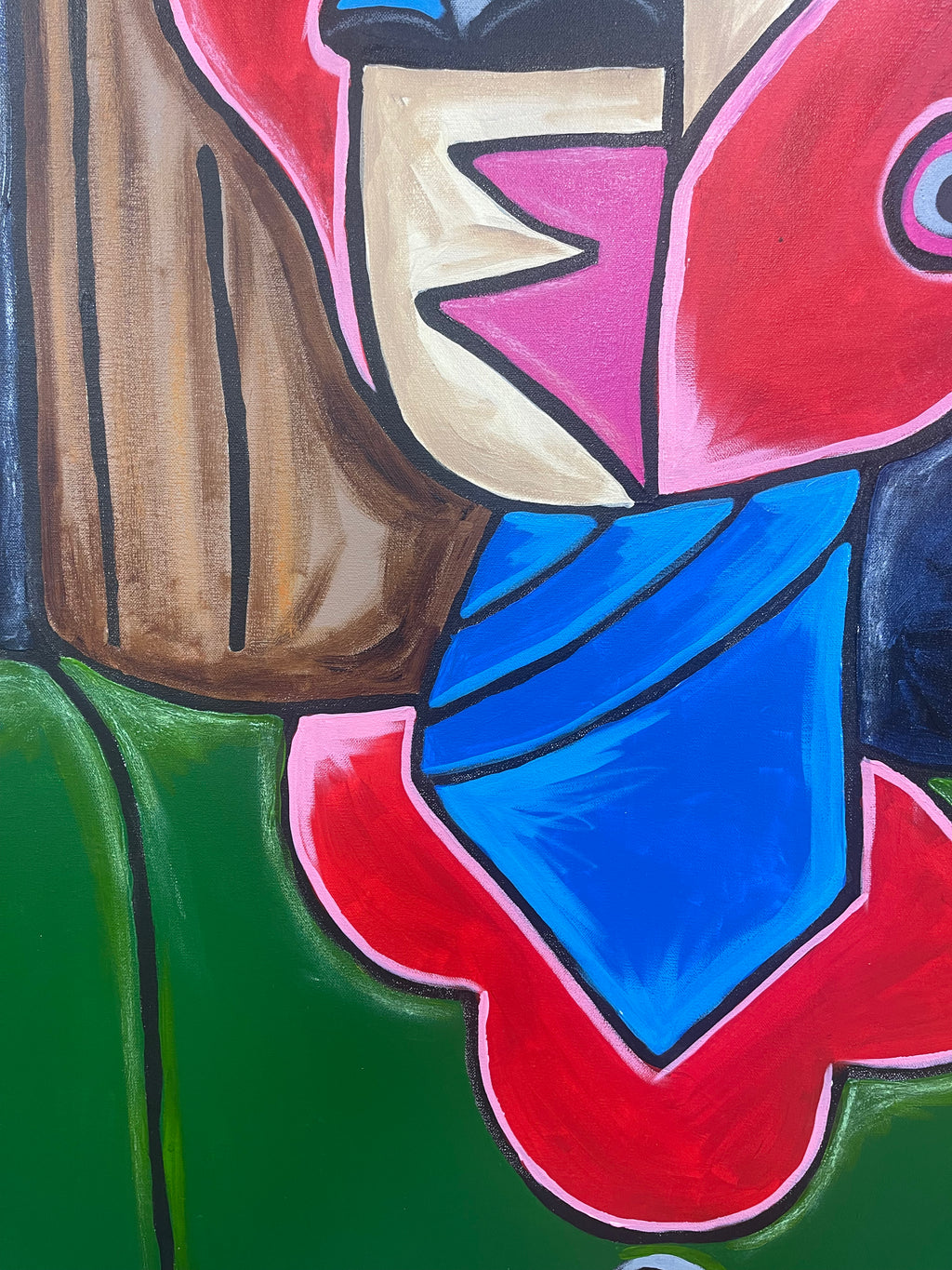 Abstract artwork with colorful shapes and a blue object on a green background