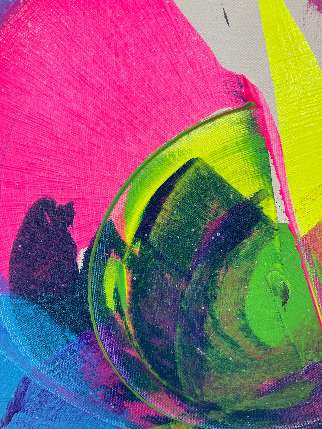 Abstract art with vibrant colors and shapes on a textured surface