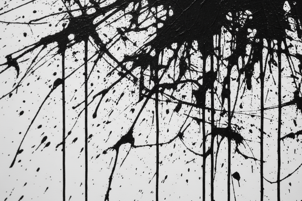 Black abstract splashes on a white background