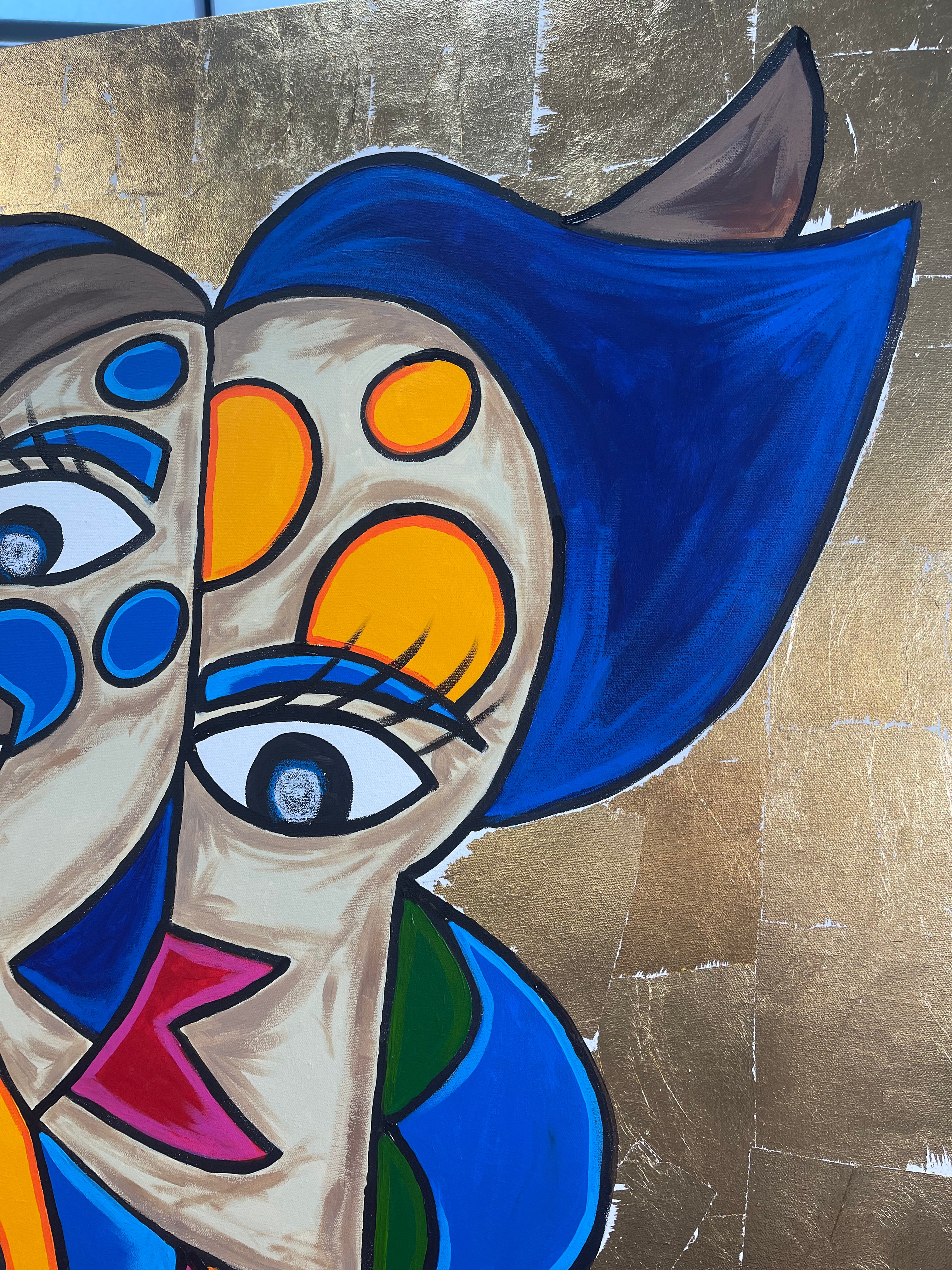 Abstract artwork with colorful faces on a textured gold background